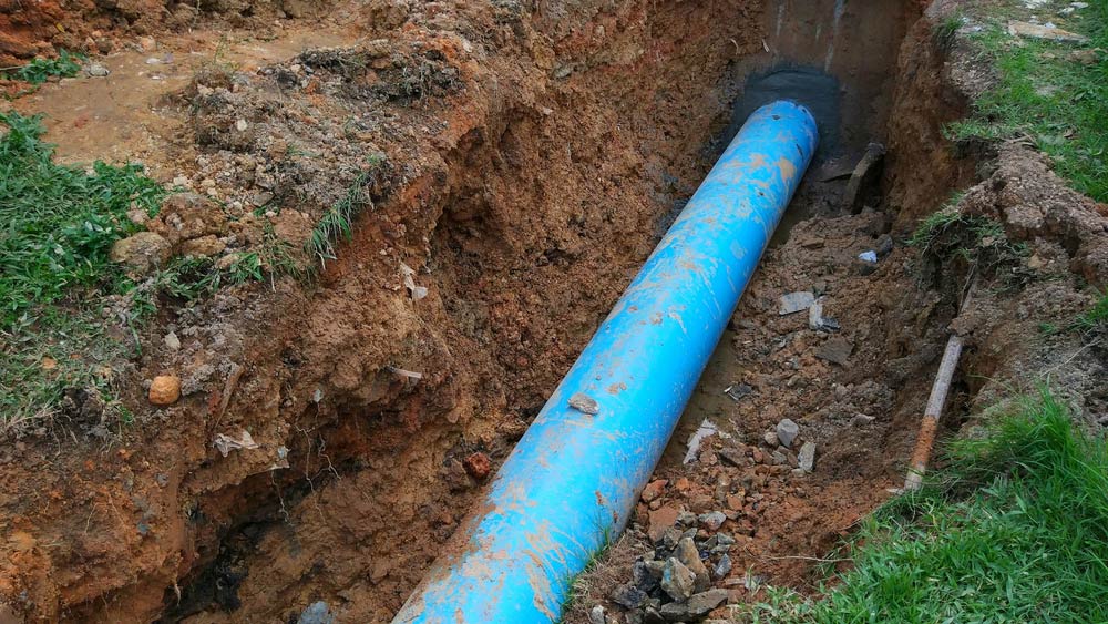Laying Out Blue Pipe - No Dig Pipe Repair in Sunshine Coast, QLD